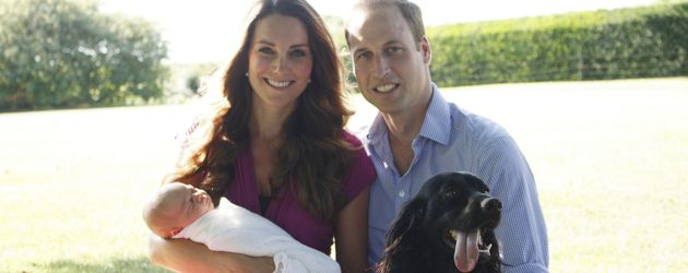 Herzogin Kate mit Prinz William und dem kleinen Prinz George im Park Herzogin Kate mit Prinz William und dem kleinen Prinz George im Park
