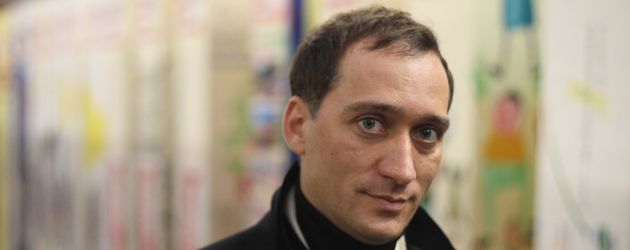 Paul van Dyk vor der Berliner Mauer